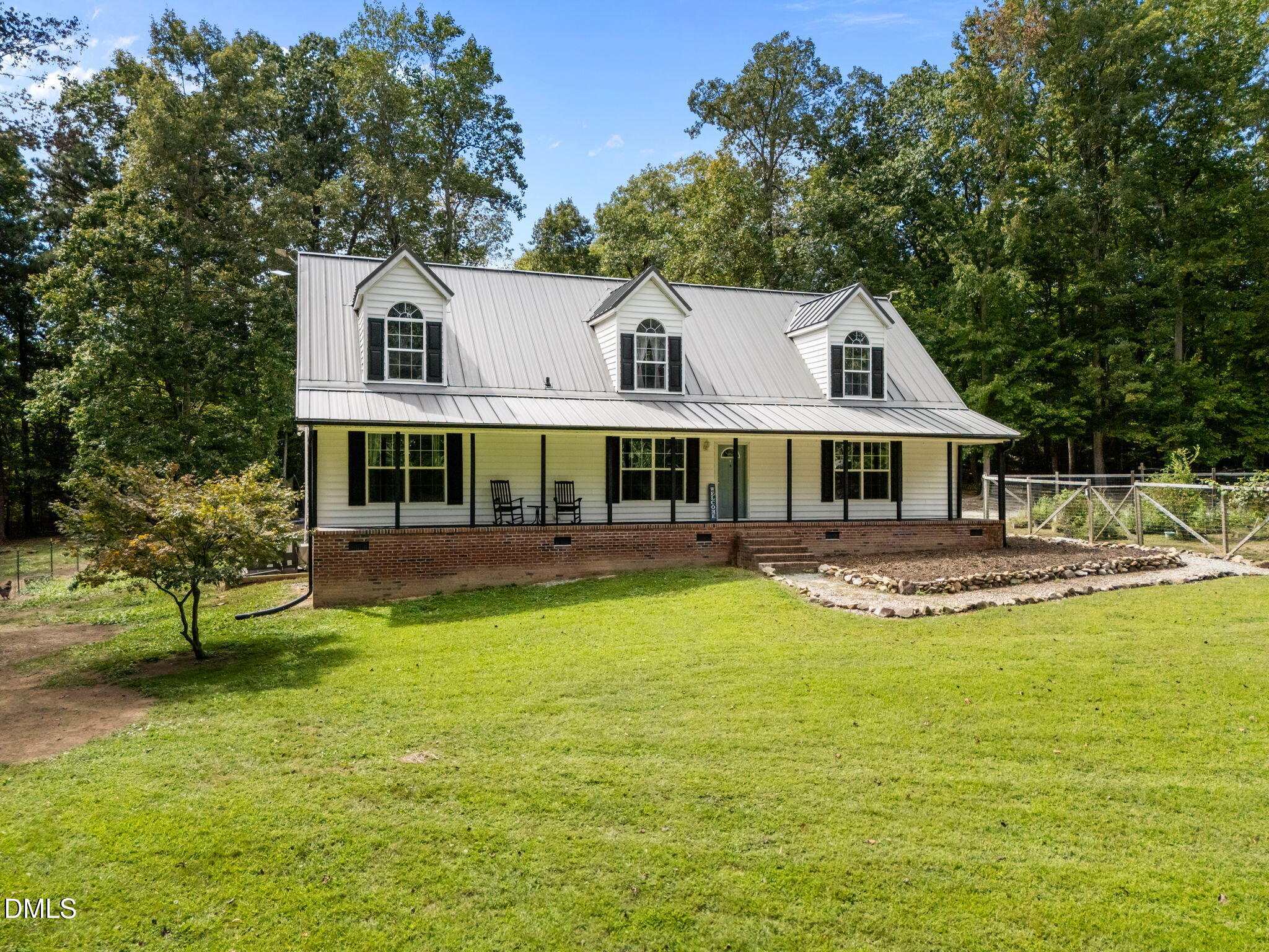 129 Family Drive Rougemont, NC 27572 - Photo 3 of 37 a front view of a house with swimming pool