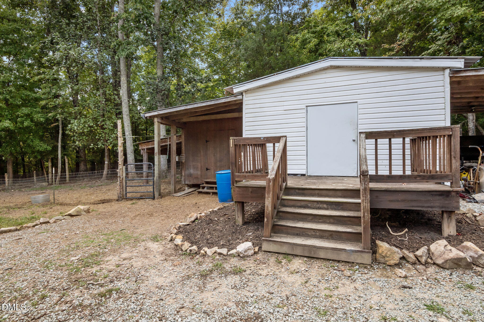 129 Family Drive Rougemont, NC 27572 - Photo 32 of 37 a view of a house with a yard and wooden fence