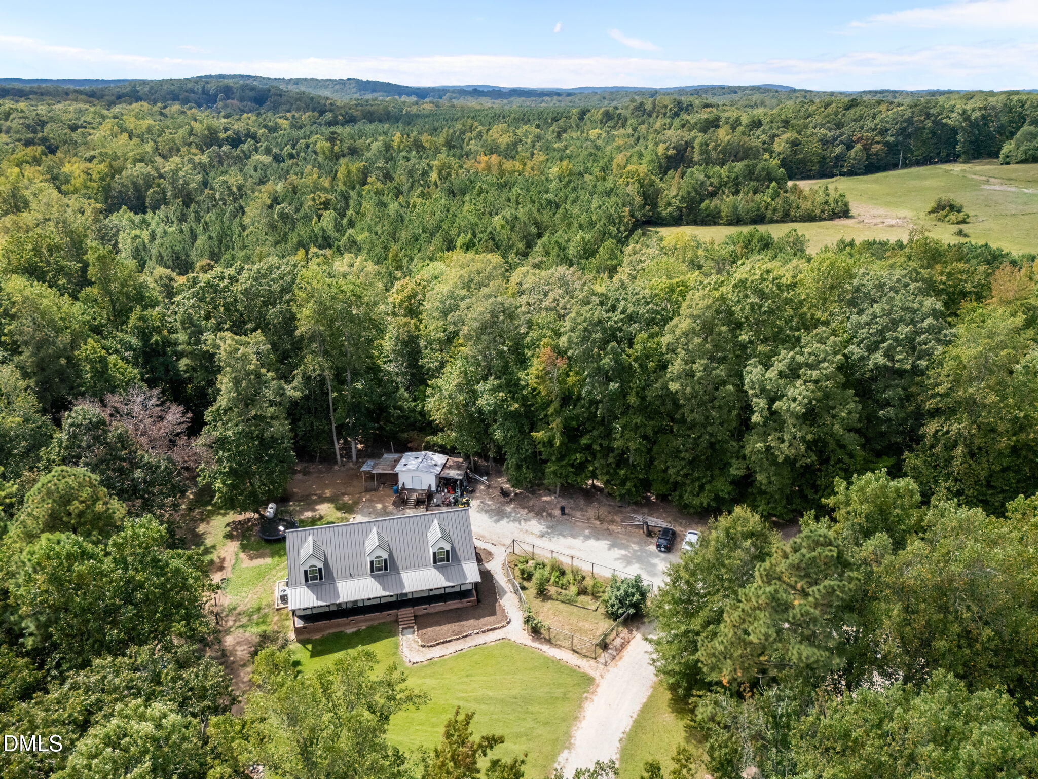 129 Family Drive Rougemont, NC 27572 - Photo 35 of 37 a view of a lake with a car parked