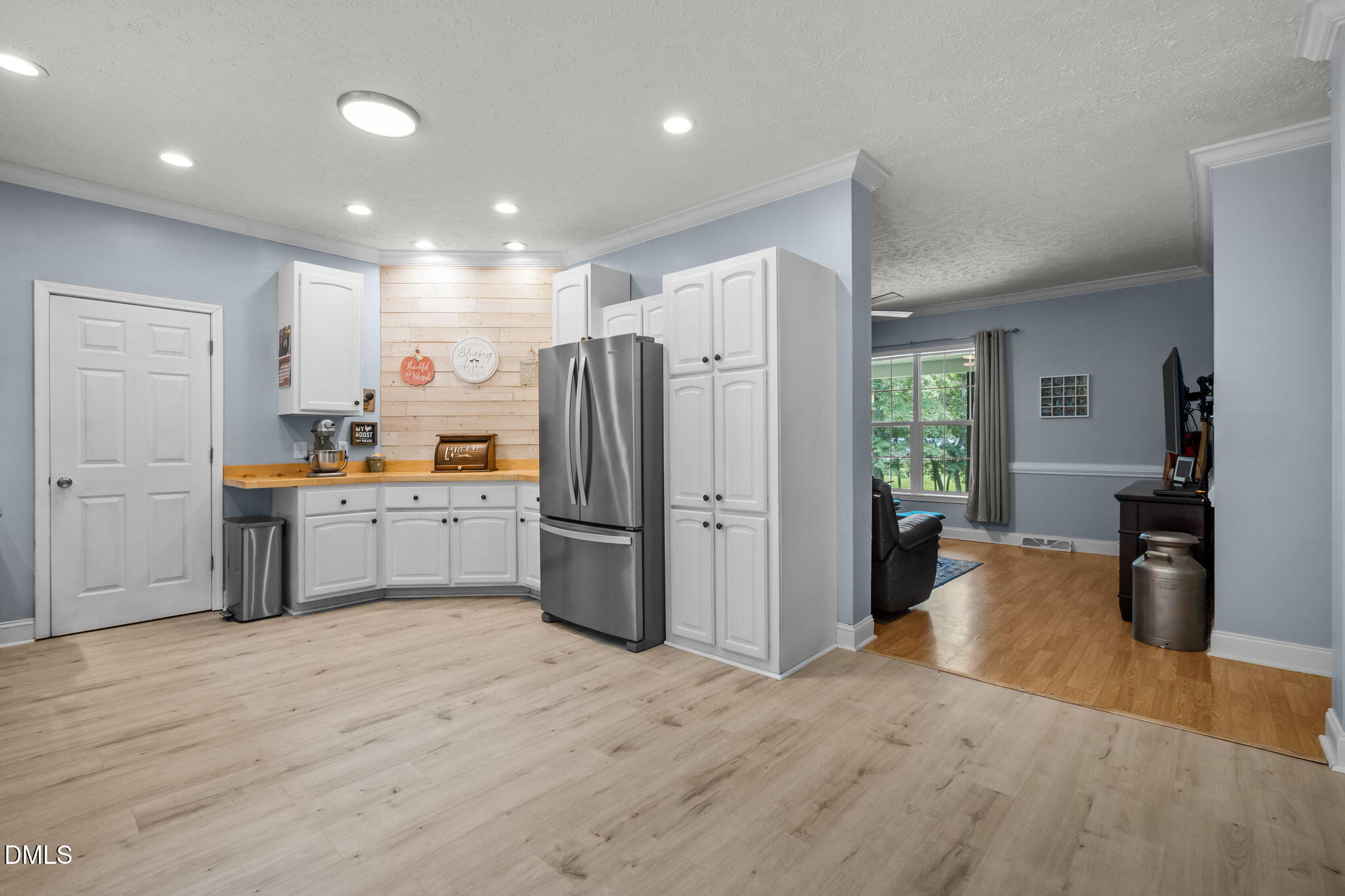 129 Family Drive Rougemont, NC 27572 - Photo 5 of 37 a kitchen with refrigerator cabinets and wooden floor
