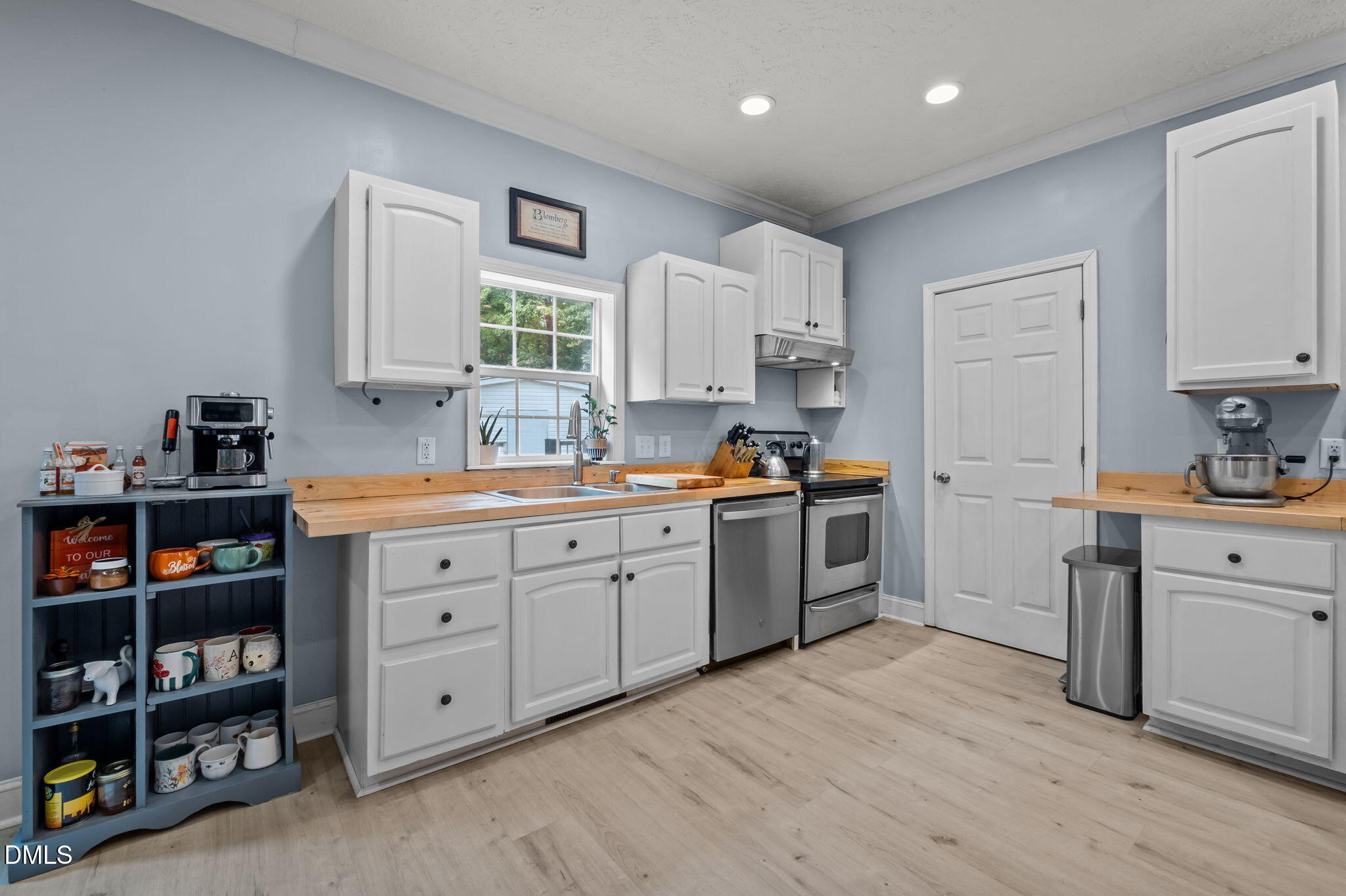 129 Family Drive Rougemont, NC 27572 - Photo 6 of 37 a kitchen with cabinets stainless steel appliances and a window