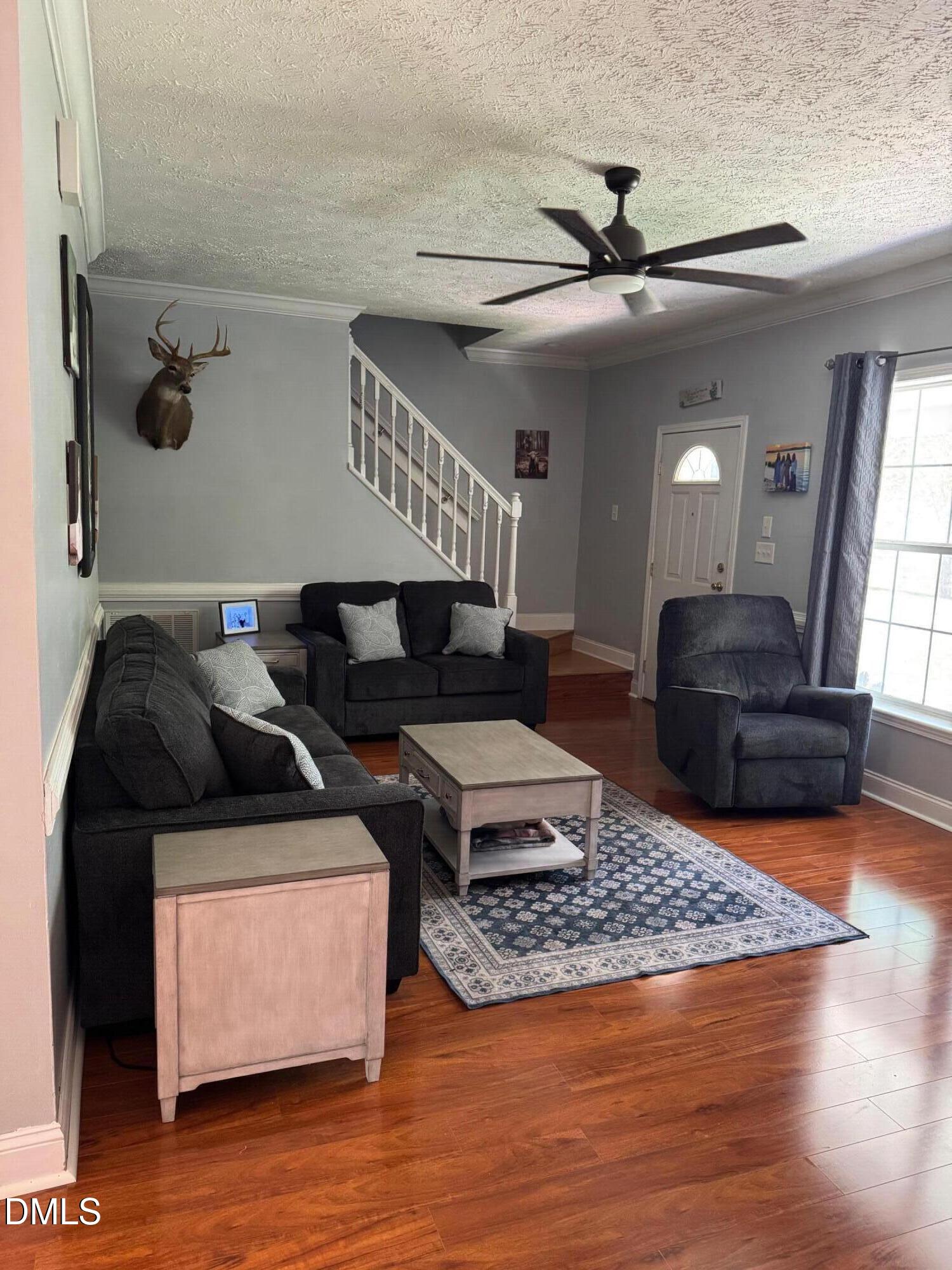 129 Family Drive Rougemont, NC 27572 - Photo 10 of 37 a living room with furniture and a wooden floor