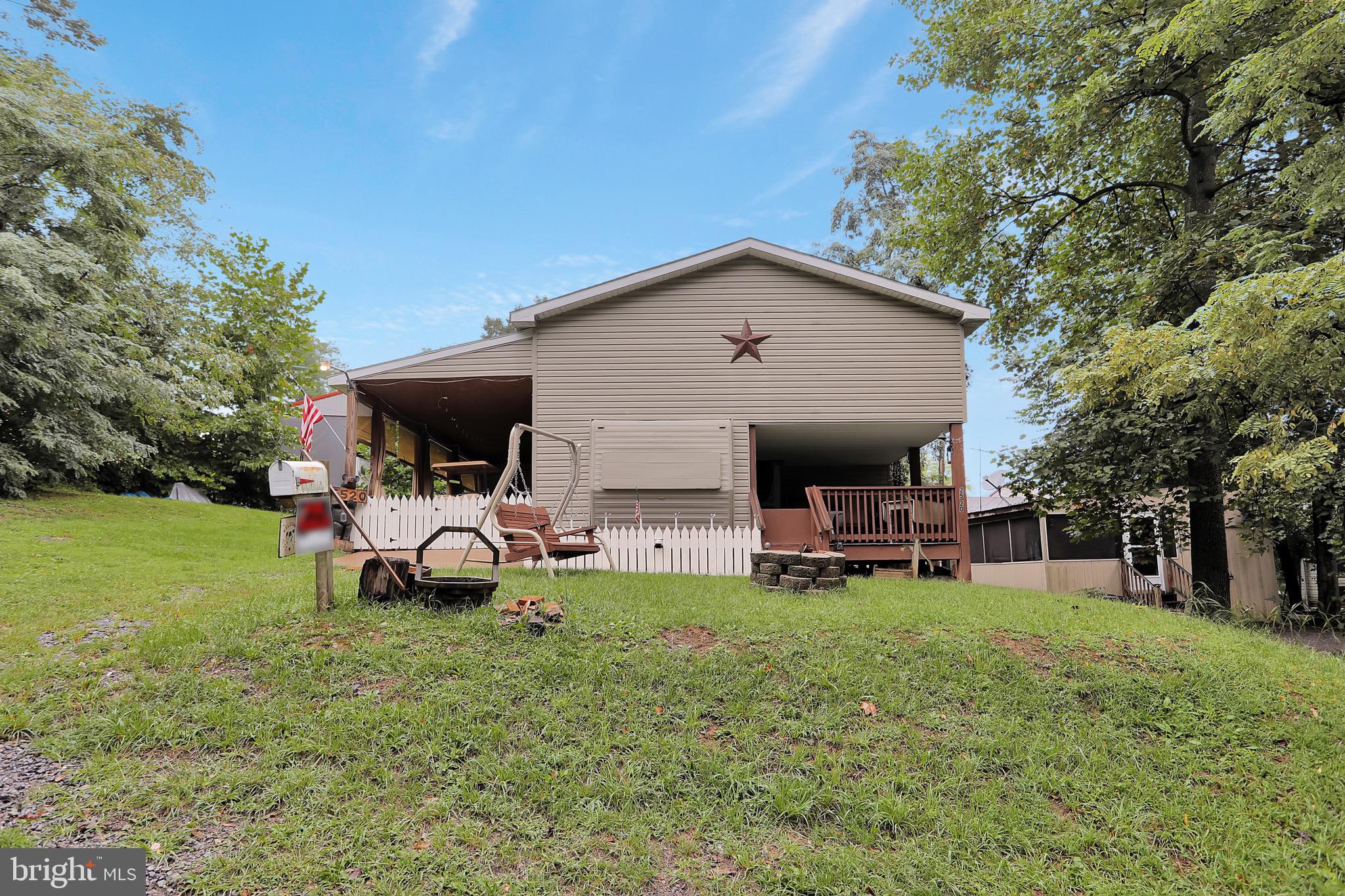 25-20 Rocky Road Falling Waters, WV 25419 - Photo 22 of 25 a view of a house with a yard porch and sitting area