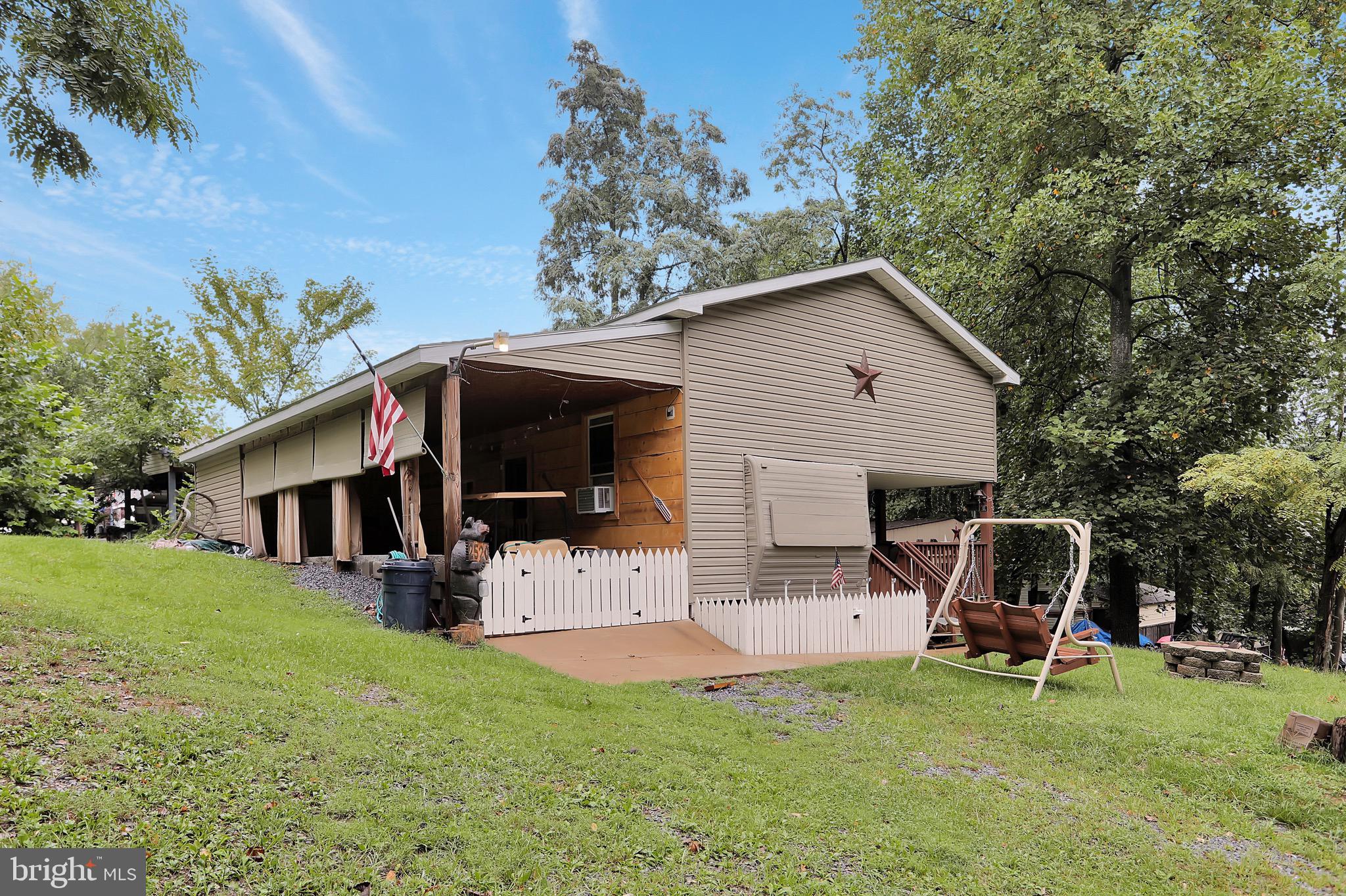 25-20 Rocky Road Falling Waters, WV 25419 - Photo 23 of 25 a view of house with backyard space and sitting area