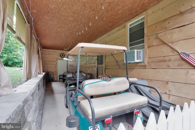 a balcony with furniture and a potted plant