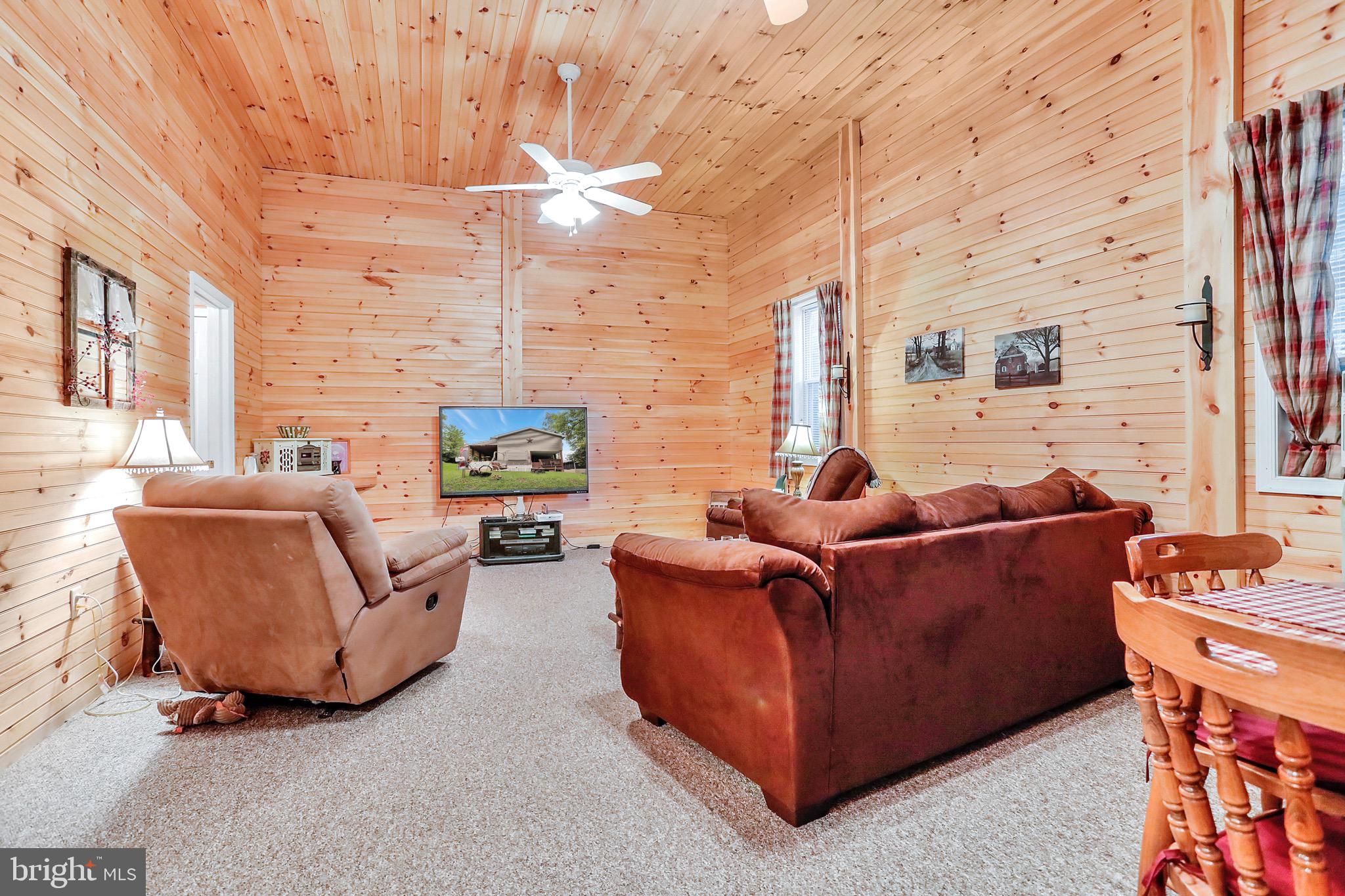 25-20 Rocky Road Falling Waters, WV 25419 - Photo 3 of 25 a living room with furniture and a fireplace