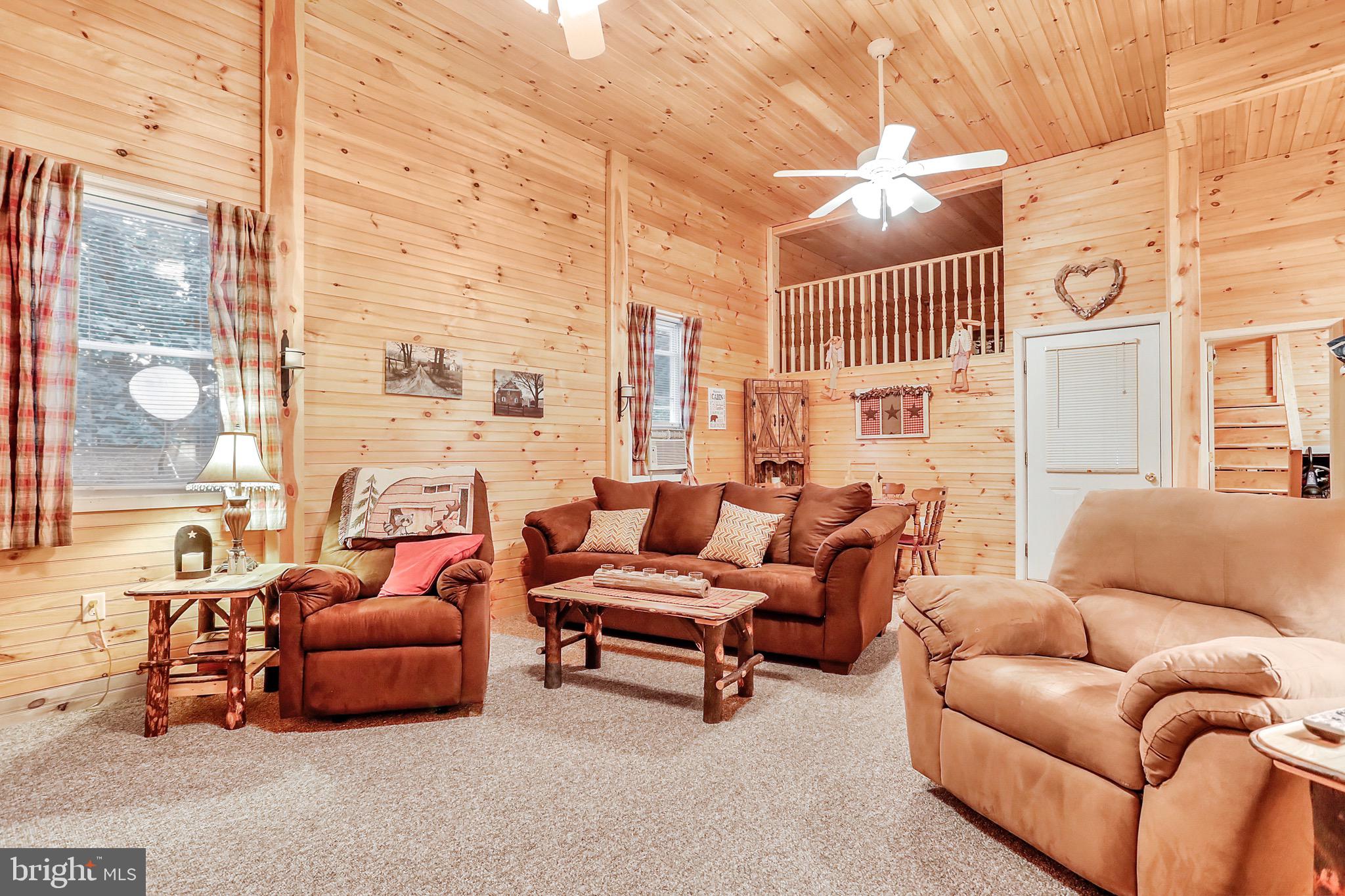 25-20 Rocky Road Falling Waters, WV 25419 - Photo 5 of 25 a living room with furniture and a large window