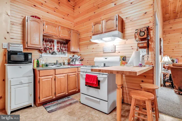 a kitchen with stainless steel appliances granite countertop a sink and cabinets
