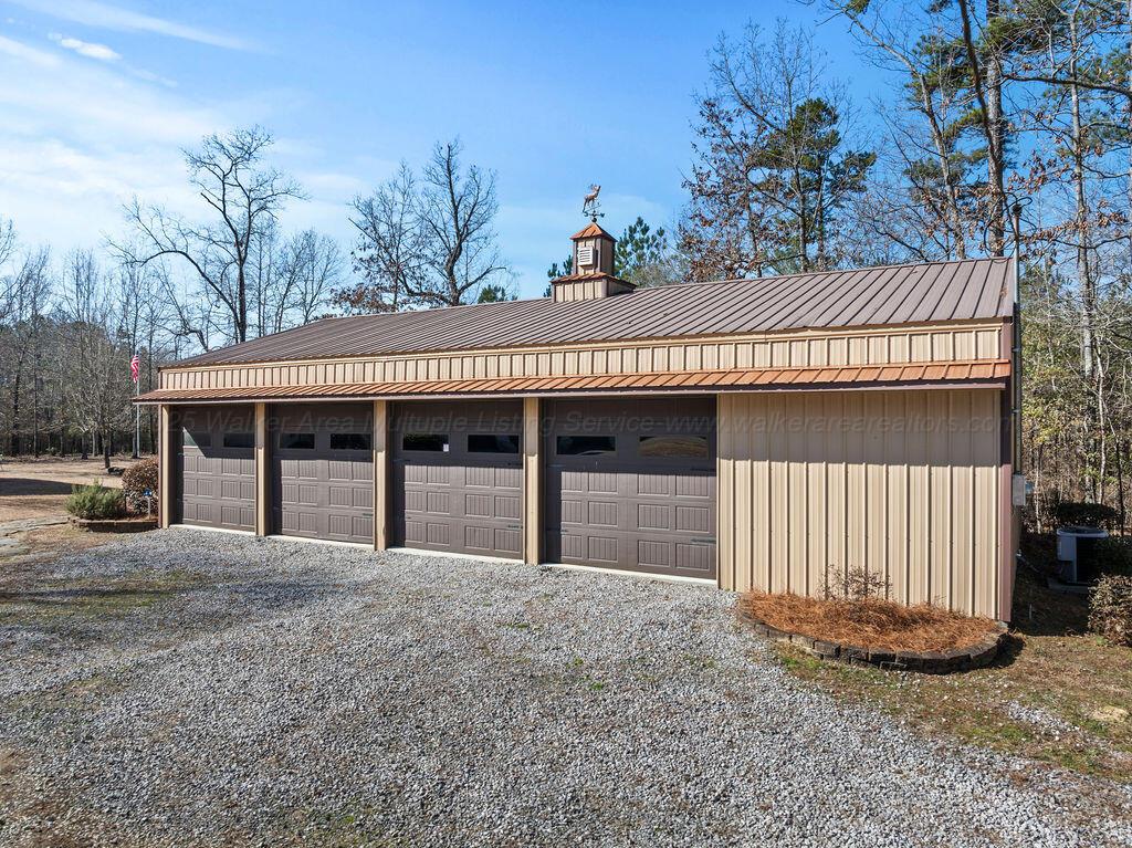 392 Baughn Road Jasper, AL 35503 - Photo 25 of 40 Heated and cooled shop with lift and storage.