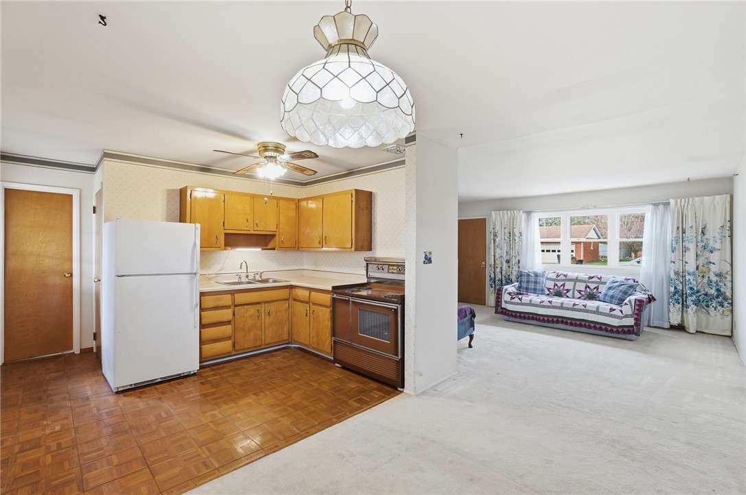 1087 Fairfield Road Troy, OH 45373 - Photo 10 of 39 This versatile space combines a functional kitchen with an adjoining living area.