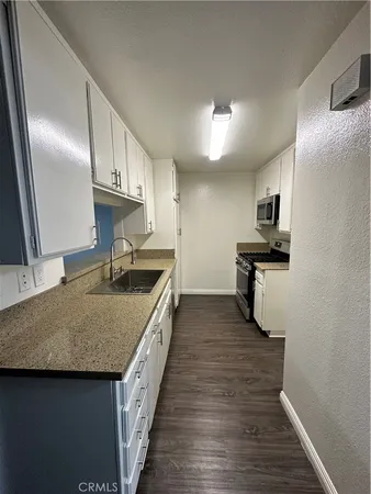 a view of cabinets and wooden floor