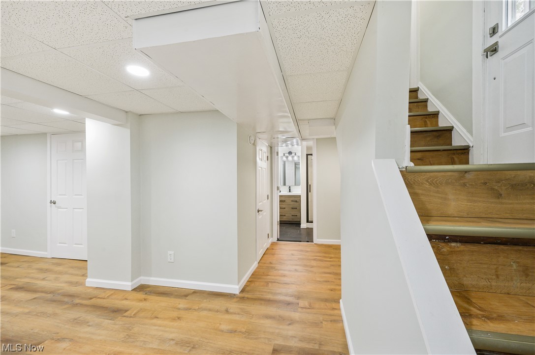 1606 Maple Road Cleveland Heights, OH 44121 - Photo 28 of 30 Partially finished basement offers options for family/recreation room or working space and renovated full bathroom(2023) with walk-in shower, sliding shower door and single vanity