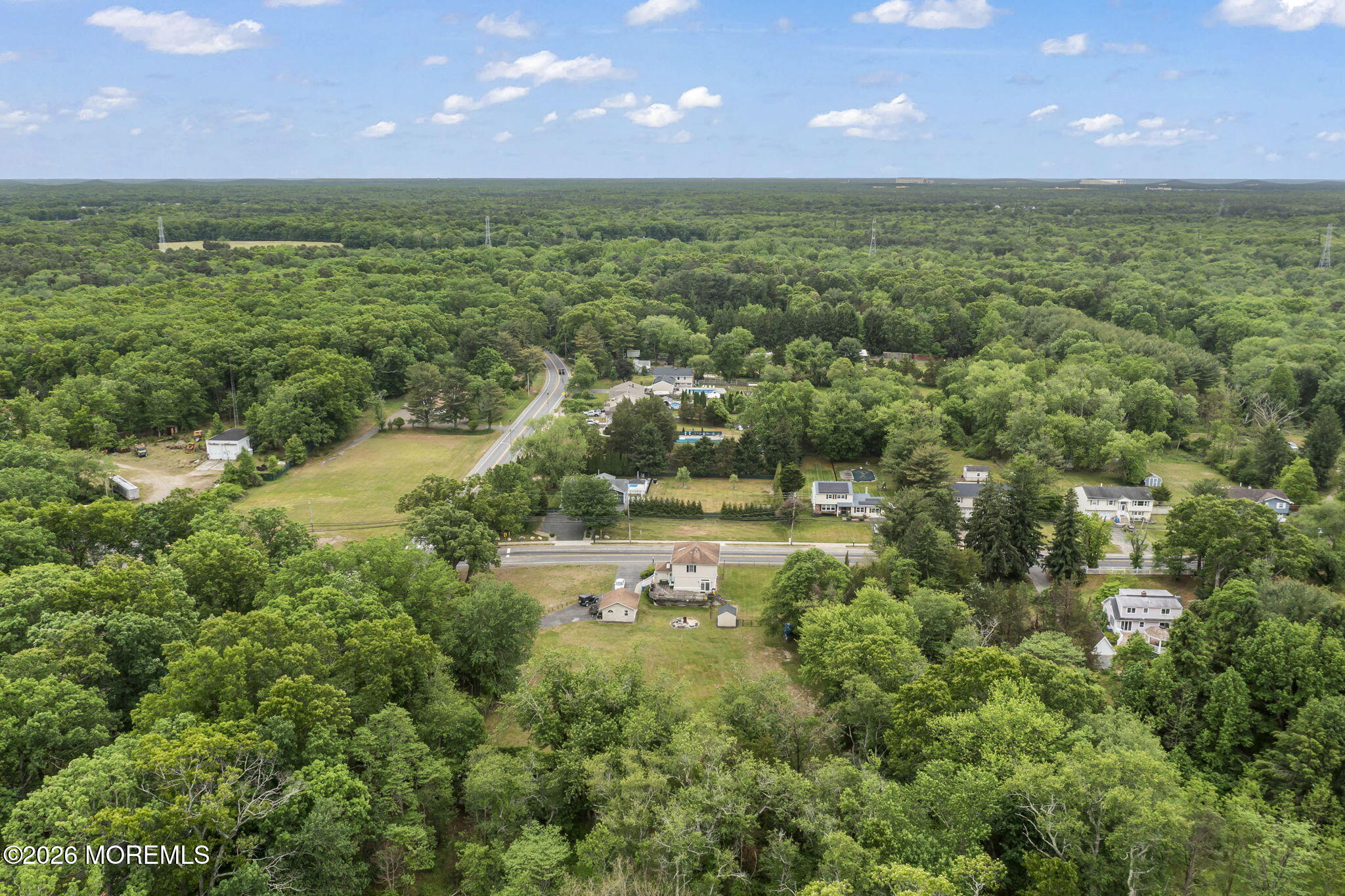 438 Bennetts Mills Road Jackson, NJ 08527 - Photo 41 of 42 a view of a lake with a yard