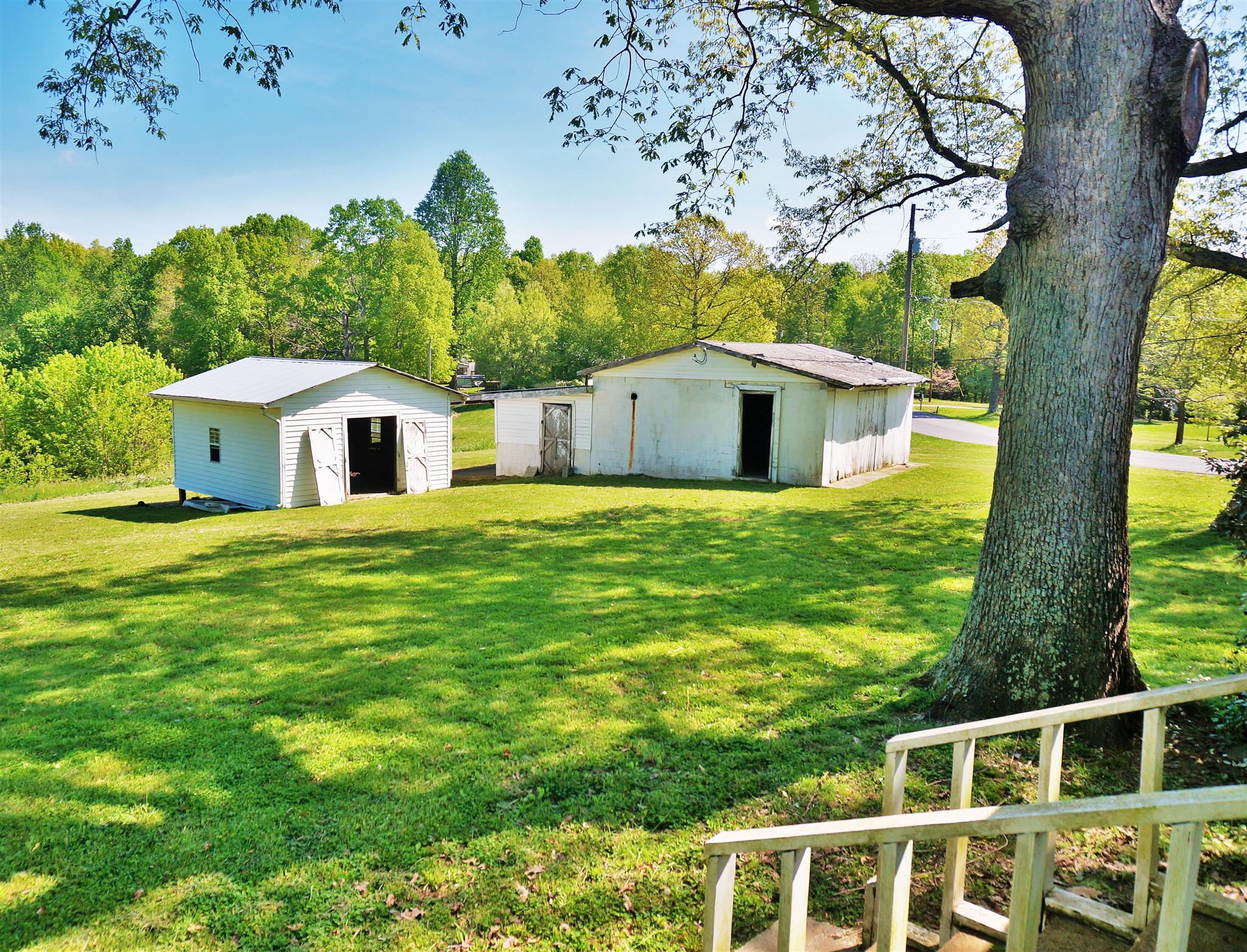 203 Rouse Road Dickson, TN 37055 - Photo 4 of 29 Back side yard with detached garage and storage building for your lawn and gardening equipment