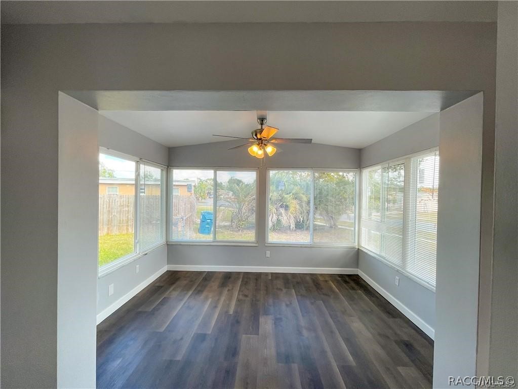 405 Copperfield Road Spring Hill, FL 34606 - Photo 12 of 25 wooden floor in an empty room with a window
