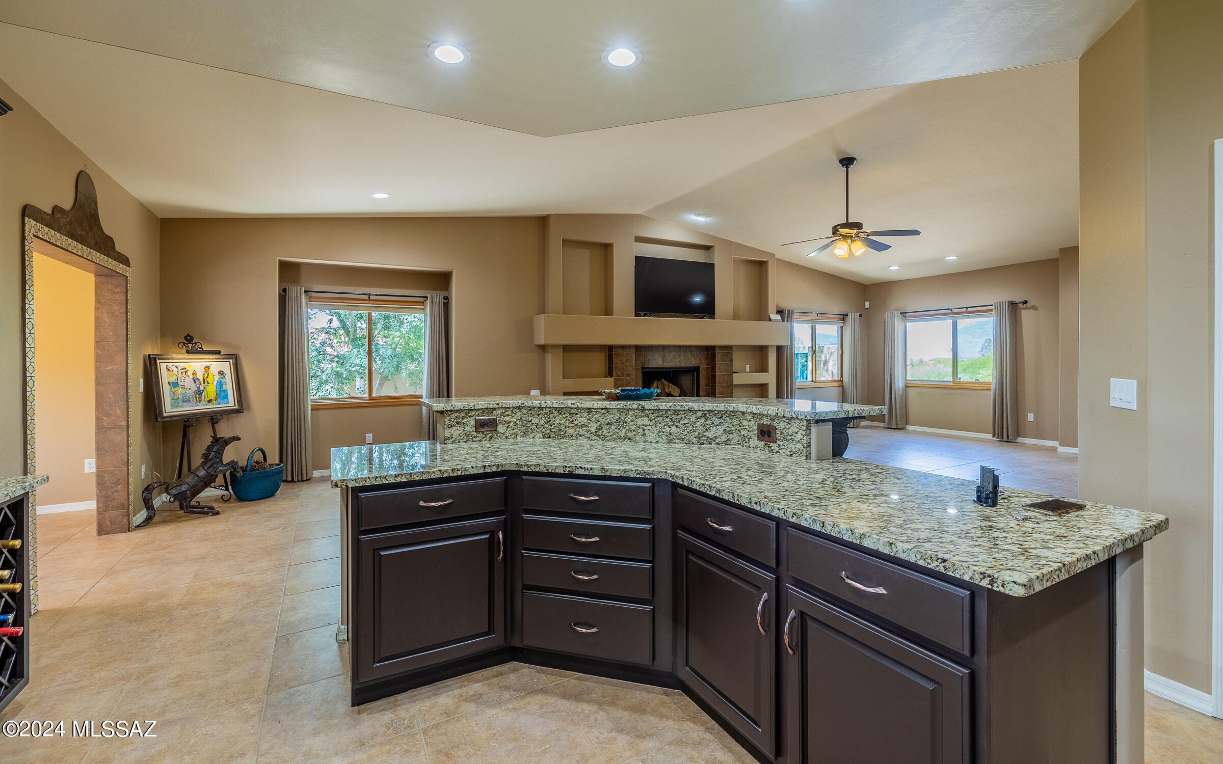 341 Sharon Road Vail, AZ 85641 - Photo 12 of 50 a kitchen with a sink stove and cabinets