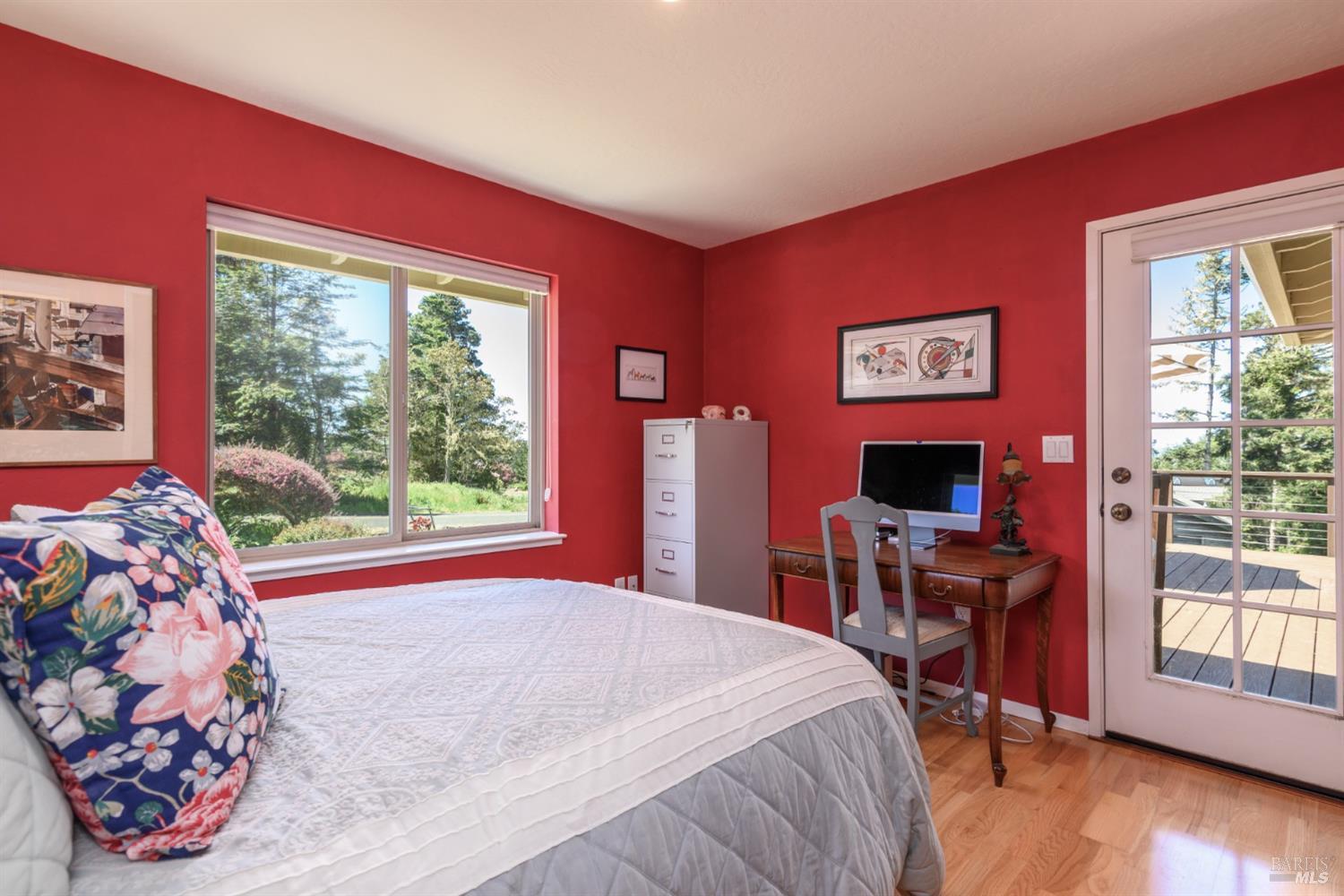 15721 Forest View Road Manchester, CA 95459 - Photo 31 of 50 The guest bedroom is light and bright and offers deck access and pretty garden views...