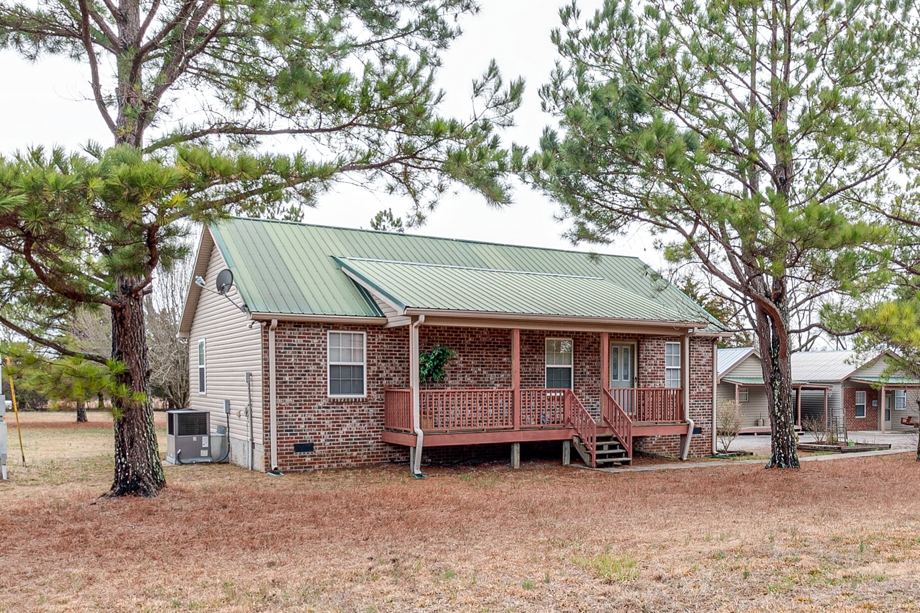 188 Zachary Road Lebanon, TN 37090 - Photo 2 of 29 a view of a house with a large tree and a car park in front of house