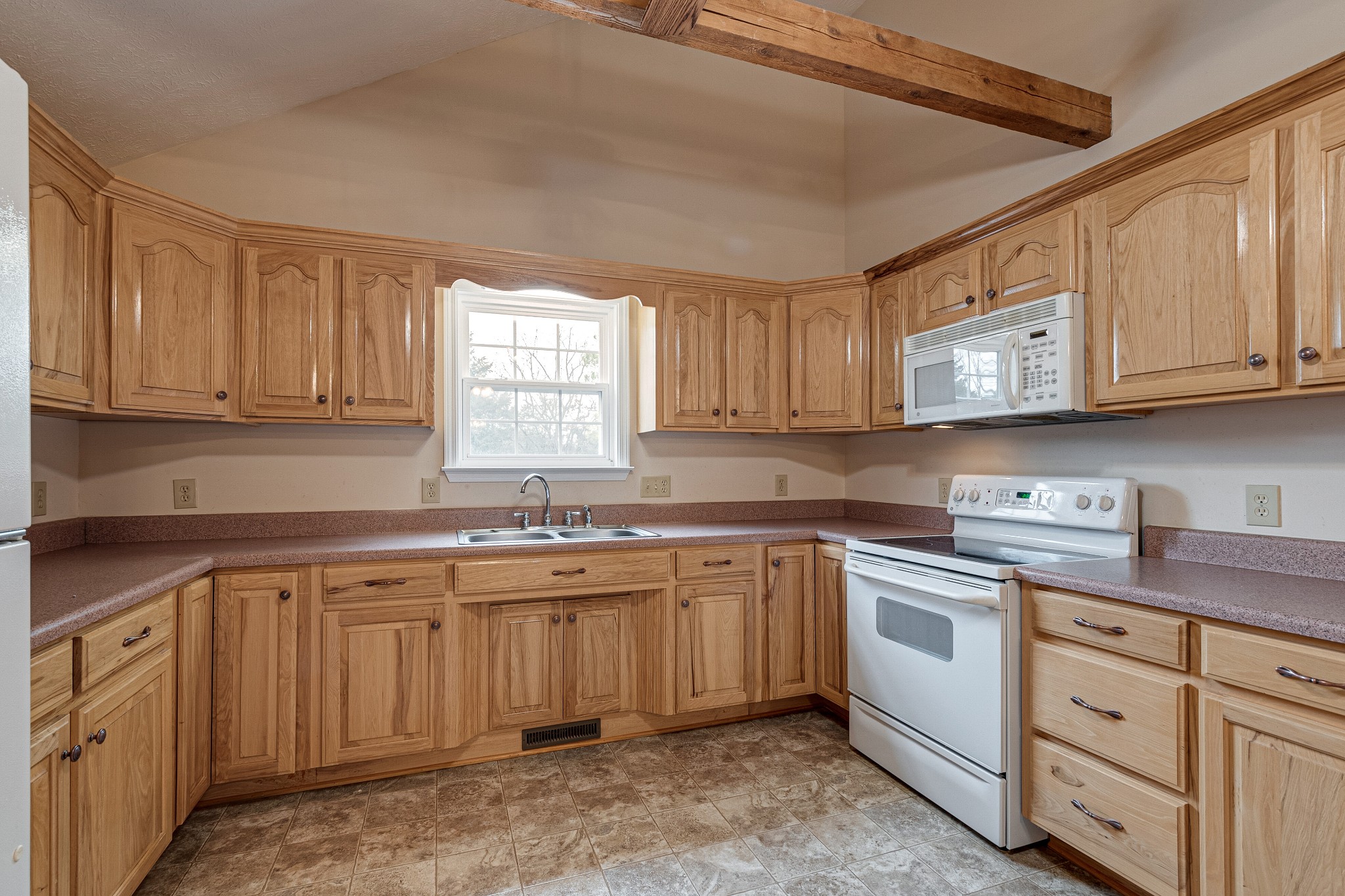 188 Zachary Road Lebanon, TN 37090 - Photo 11 of 29 a kitchen with cabinets appliances a sink and a window