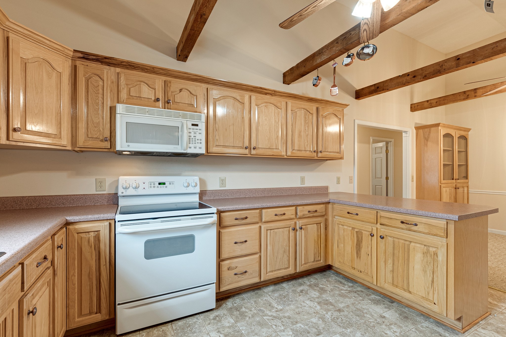 188 Zachary Road Lebanon, TN 37090 - Photo 12 of 29 a kitchen with stainless steel appliances granite countertop a stove and a microwave