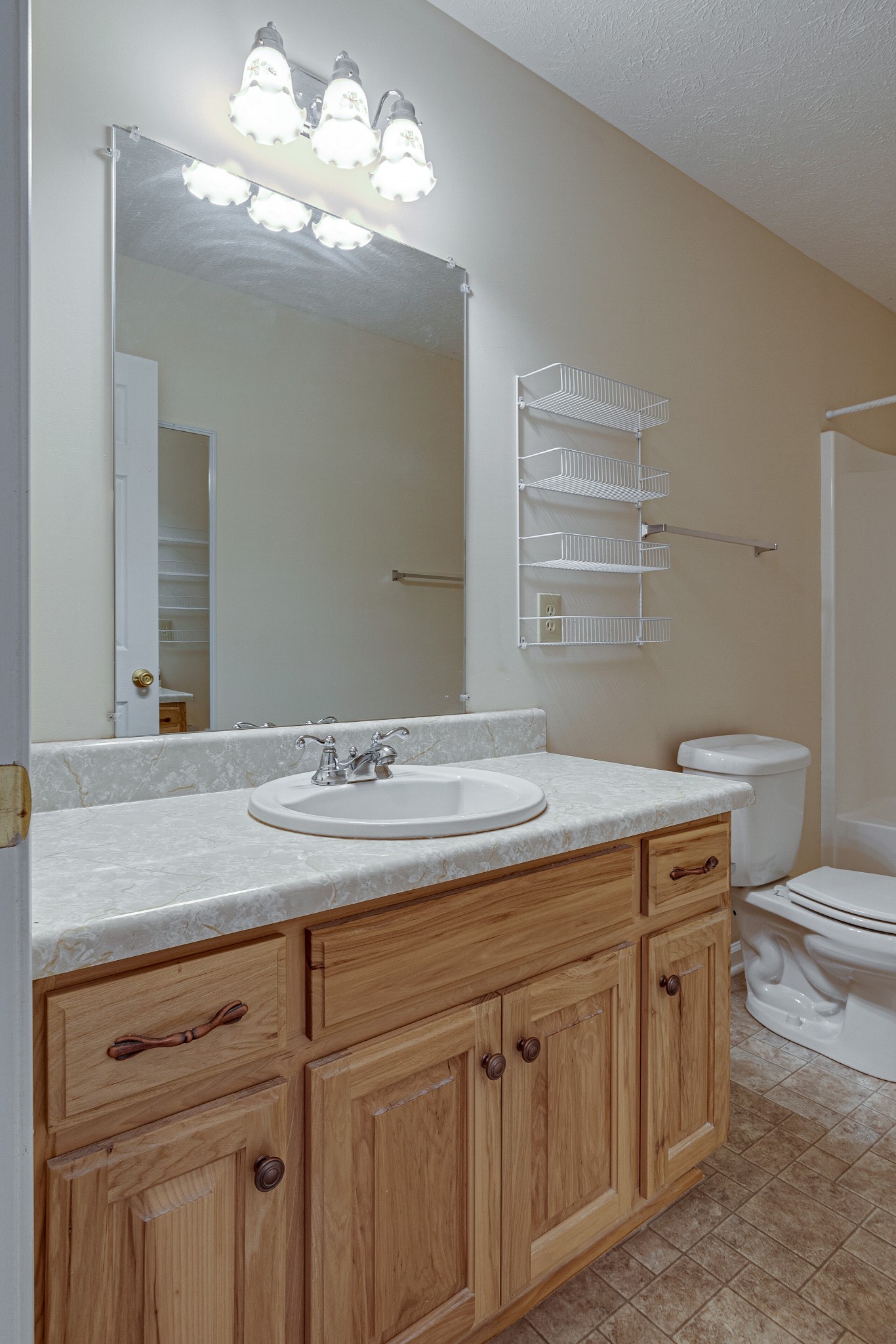188 Zachary Road Lebanon, TN 37090 - Photo 18 of 29 a bathroom with a granite countertop sink a toilet and a mirror
