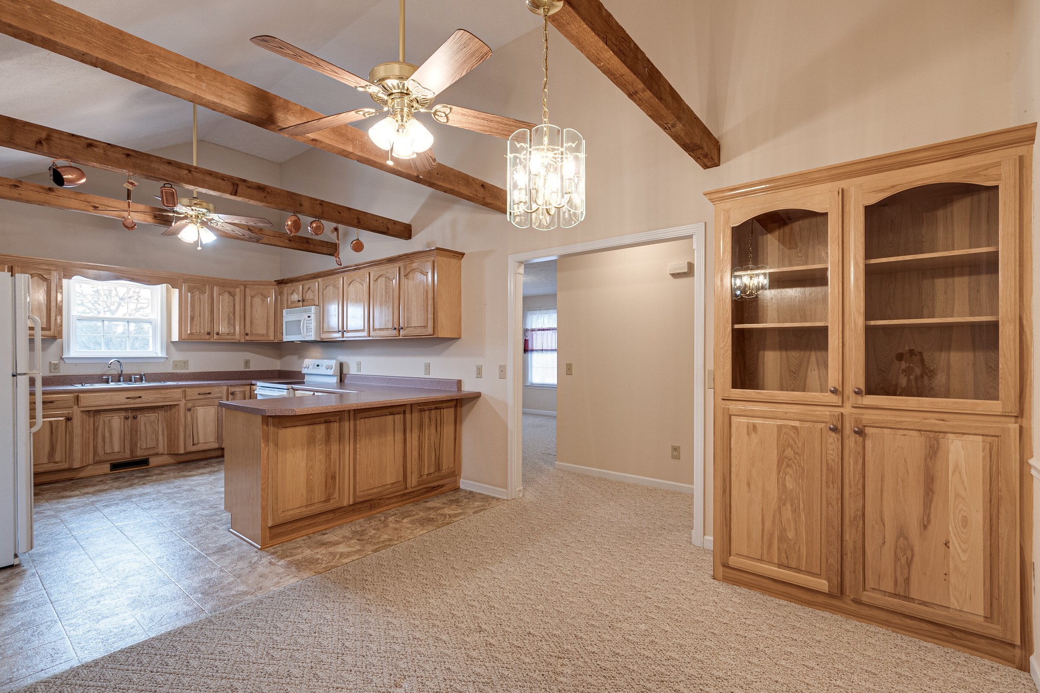 188 Zachary Road Lebanon, TN 37090 - Photo 8 of 29 a kitchen with stainless steel appliances granite countertop a refrigerator a sink a stove and white cabinets