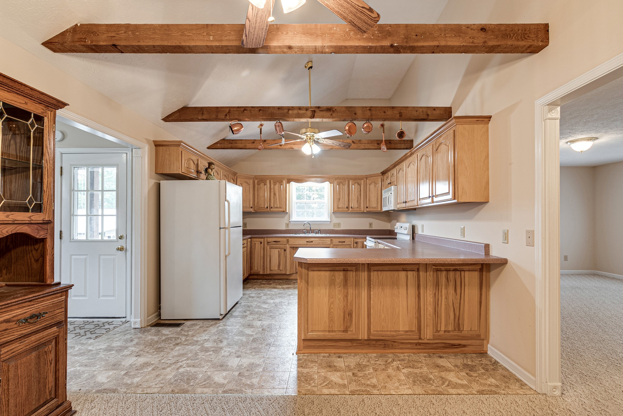 188 Zachary Road Lebanon, TN 37090 - Photo 10 of 29 a kitchen with a sink a refrigerator and cabinets
