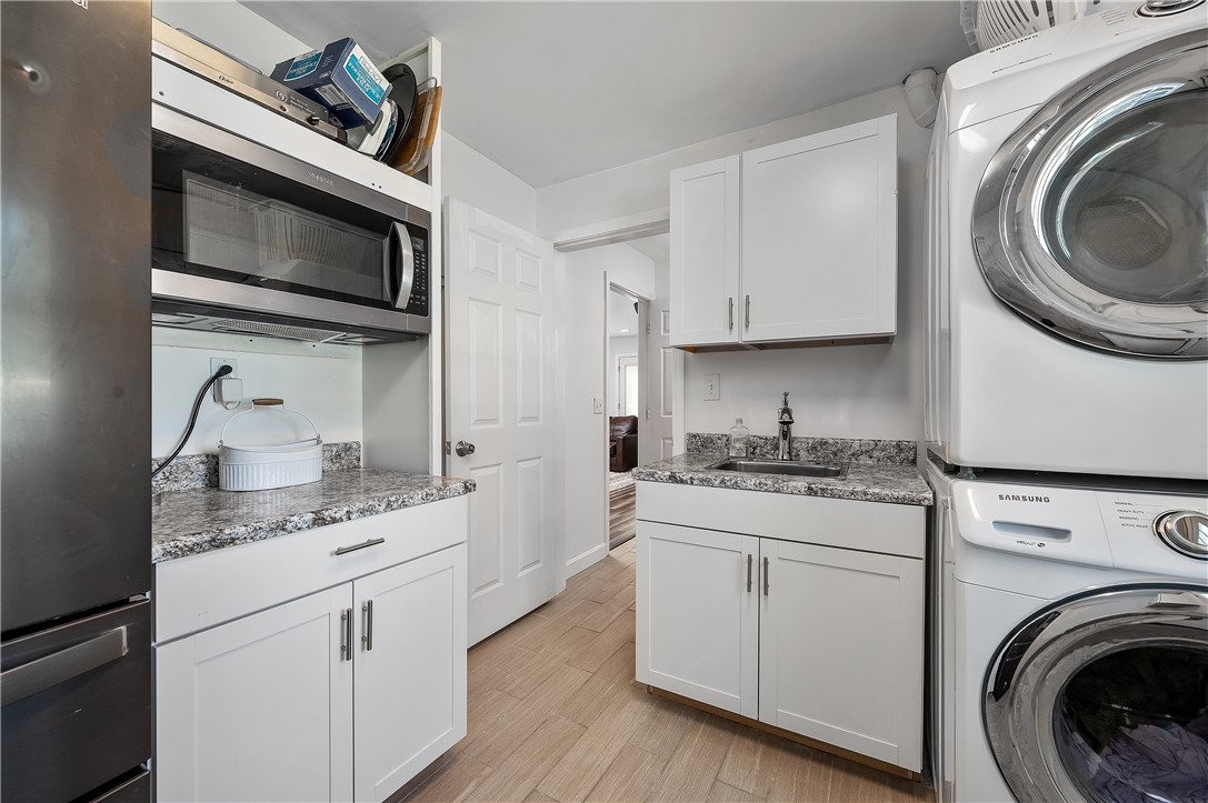 204 Shady Valley Road Coventry, RI 02816 - Photo 26 of 48 1st floor laundry with sink, microwave, full size refridgerator