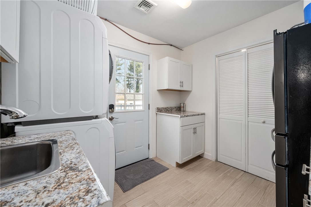 204 Shady Valley Road Coventry, RI 02816 - Photo 27 of 48 1st floor laundry, with sink, microwave, full size refrigerator