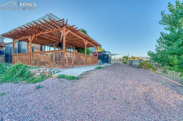 a view of a house with a yard porch and sitting area