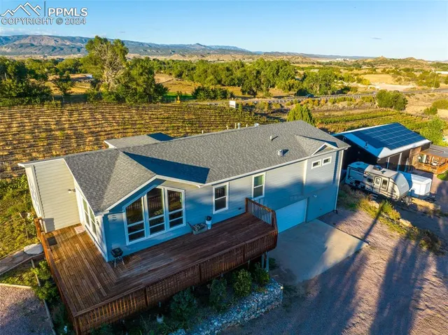 a aerial view of a house with a ocean view
