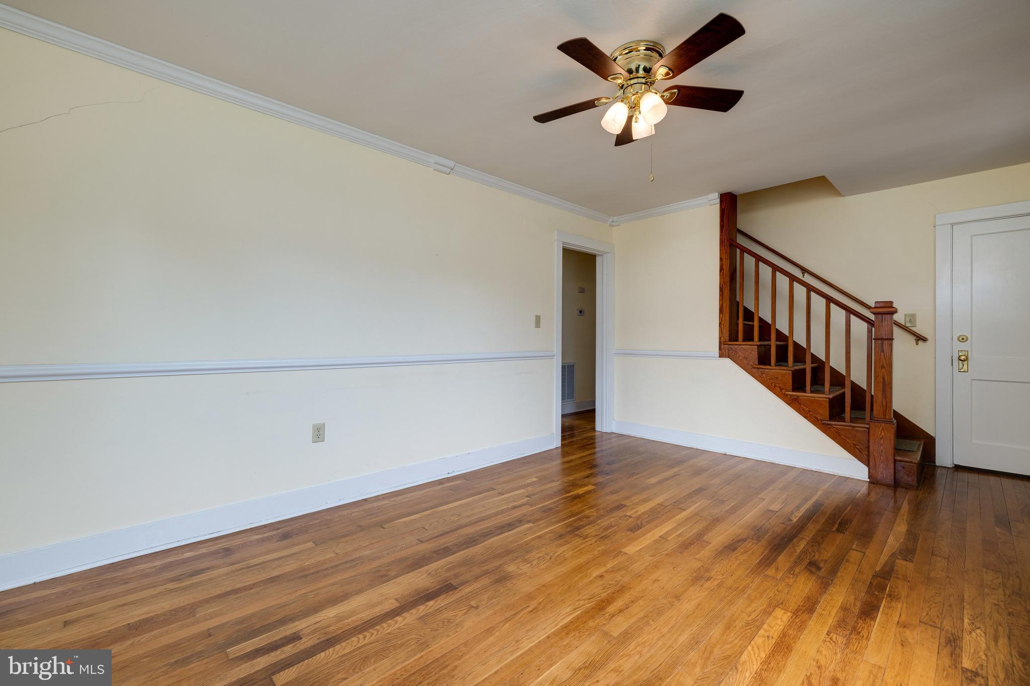 220 Mechanic Street Luray, VA 22835 - Photo 16 of 45 a view of an empty room with wooden floor