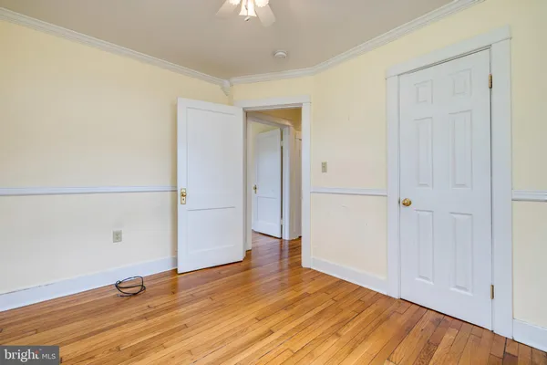 an empty room with wooden floor
