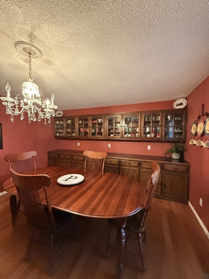 405 Robins Street Lawrenceburg, TN 38464 - Photo 7 of 49 a dining room with furniture and chandelier