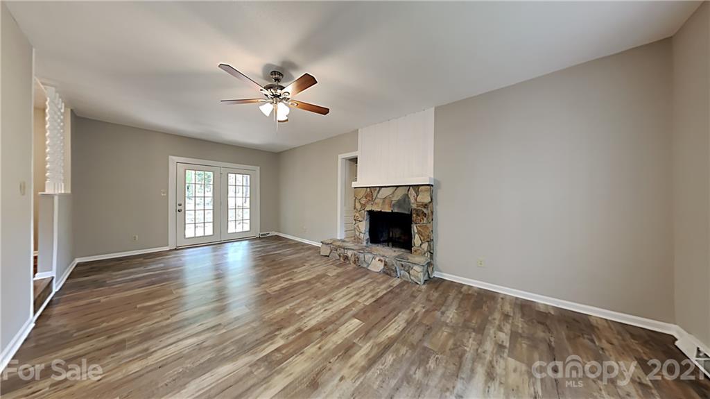 1606 Willowbrook Drive Fort Mill, SC 29708 - Photo 3 of 12 wooden floor in an empty room with a window