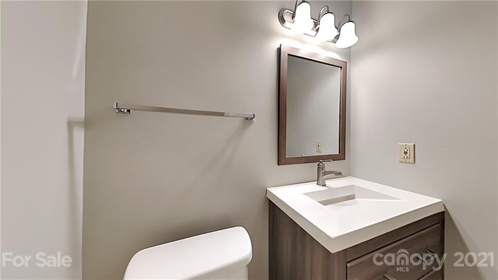 1606 Willowbrook Drive Fort Mill, SC 29708 - Photo 5 of 12 a bathroom with a sink a toilet and mirror