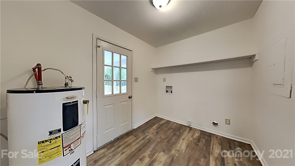 1606 Willowbrook Drive Fort Mill, SC 29708 - Photo 6 of 12 a view of a livingroom with wooden floor and a window