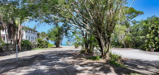 a view of a tree in front of a house