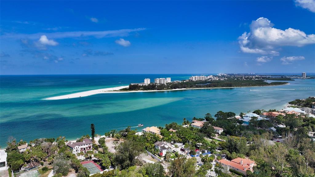 4105 North Shell Road Sarasota, FL 34242 - Photo 10 of 26 a view of a lake with a building in the background