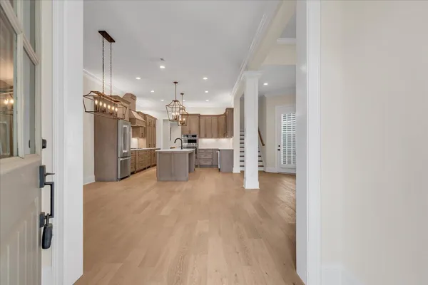 a kitchen with stainless steel appliances a stove sink and cabinets