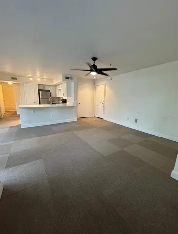 a view of a kitchen with a sink and a window