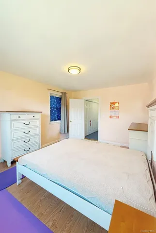 a bedroom with a bed and dresser