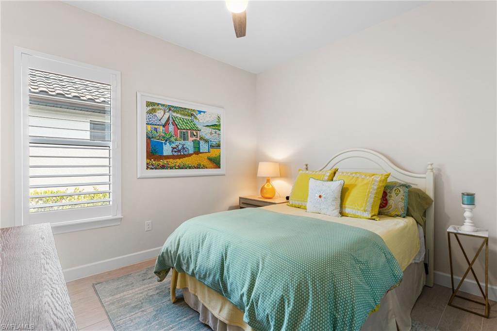 15216 Turin Drive Naples, FL 34114 - Photo 25 of 50 Bedroom with ceiling fan and light wood-style flooring