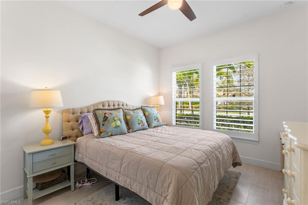 15216 Turin Drive Naples, FL 34114 - Photo 27 of 50 Bedroom featuring light wood-style flooring and ceiling fan