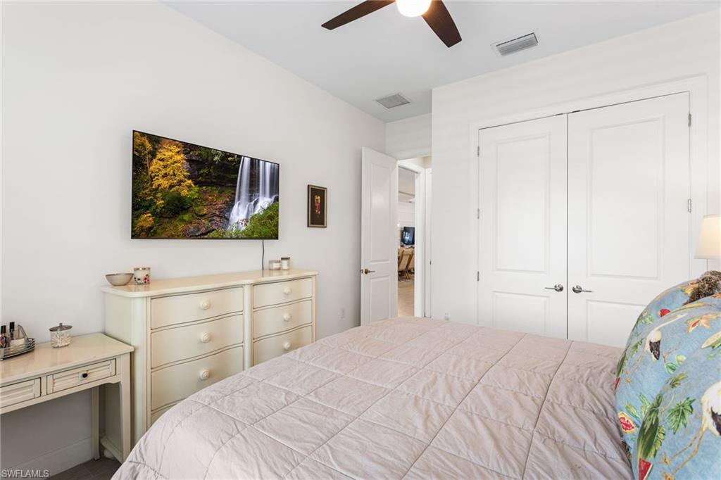 15216 Turin Drive Naples, FL 34114 - Photo 28 of 50 Bedroom featuring a closet and ceiling fan