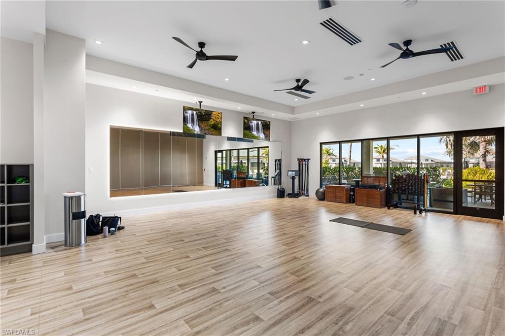15216 Turin Drive Naples, FL 34114 - Photo 43 of 50 Workout area with a high ceiling, recessed lighting, and a ceiling fan