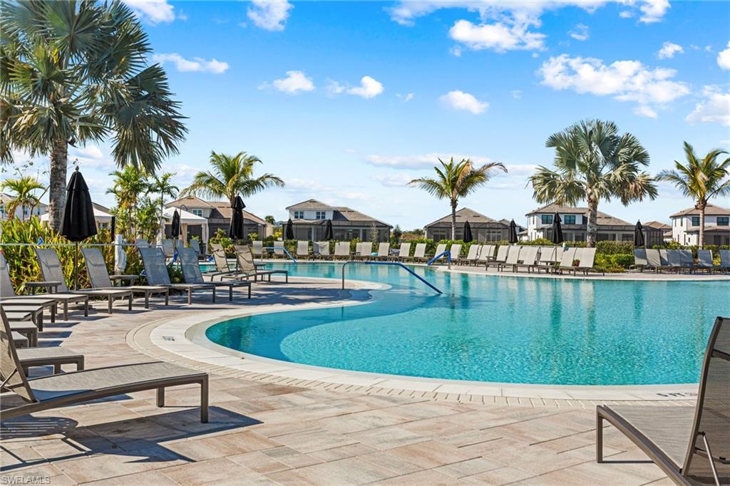 15216 Turin Drive Naples, FL 34114 - Photo 48 of 50 Community pool with a patio and a residential view