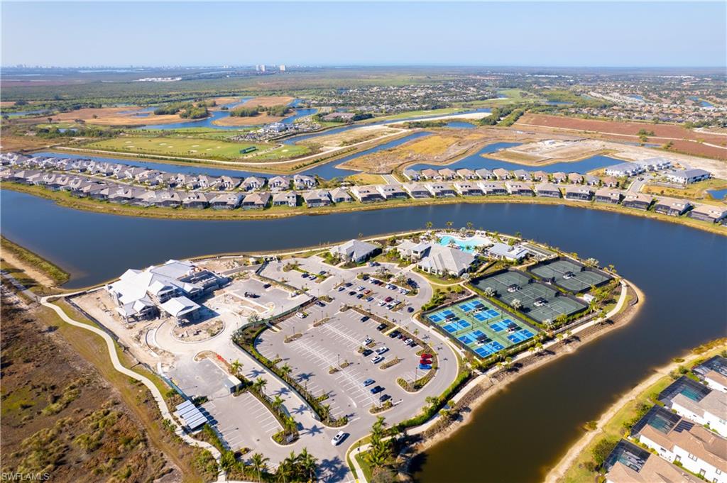15216 Turin Drive Naples, FL 34114 - Photo 49 of 50 Aerial overview of property's location with nearby suburban area and a nearby body of water