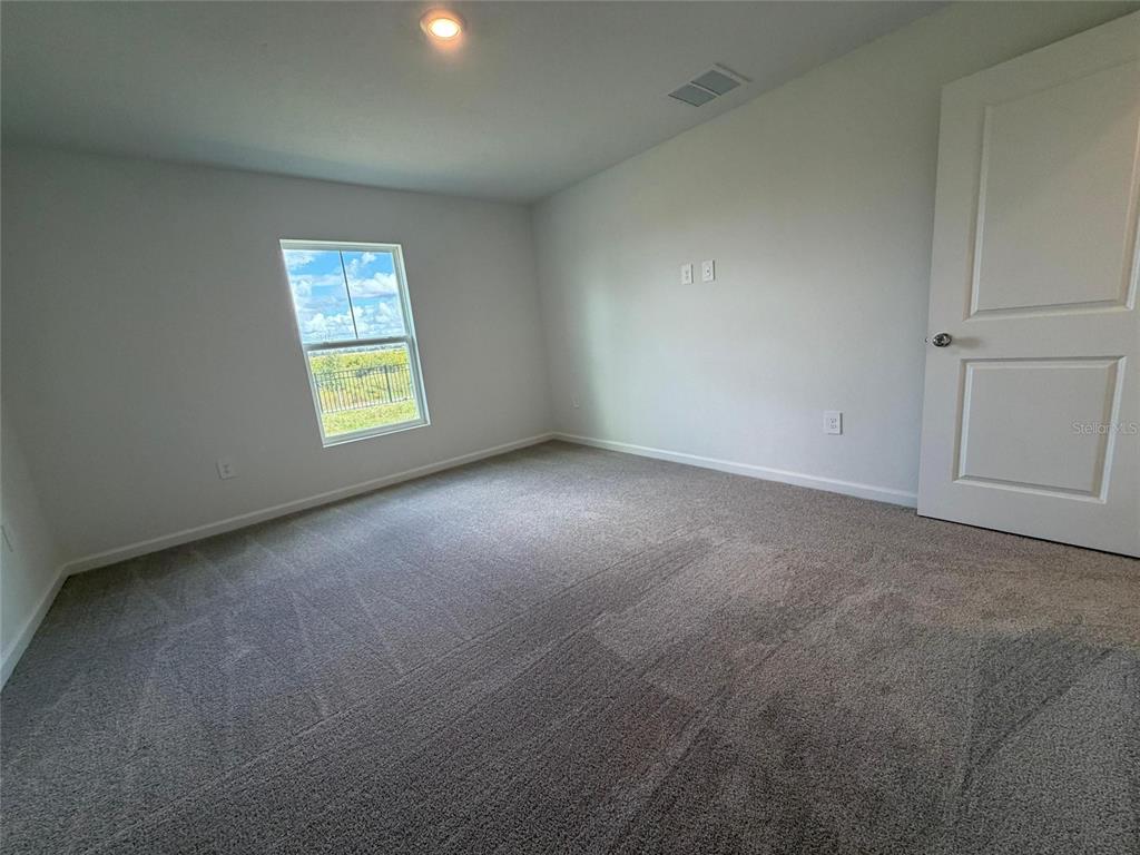 3484 Chinotto Drive Lake Alfred, FL 33850 - Photo 12 of 32 a view of an empty room with a window