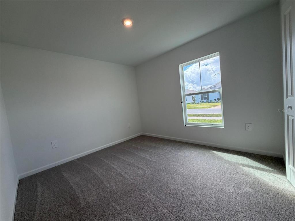 3484 Chinotto Drive Lake Alfred, FL 33850 - Photo 13 of 32 an empty room with windows